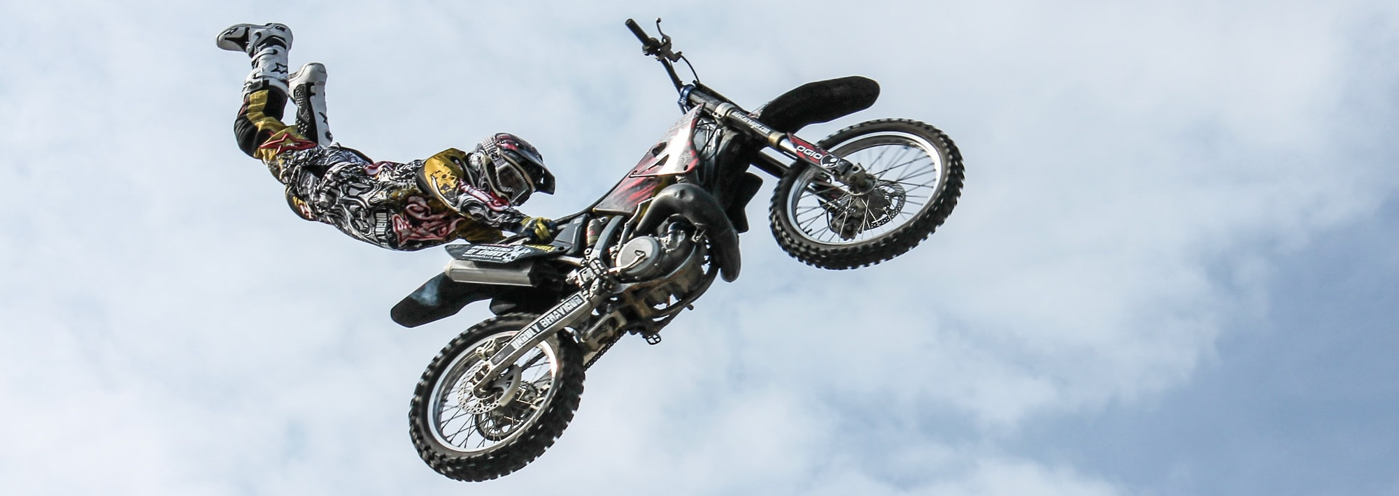 A motocross rider performing an aerial trick.